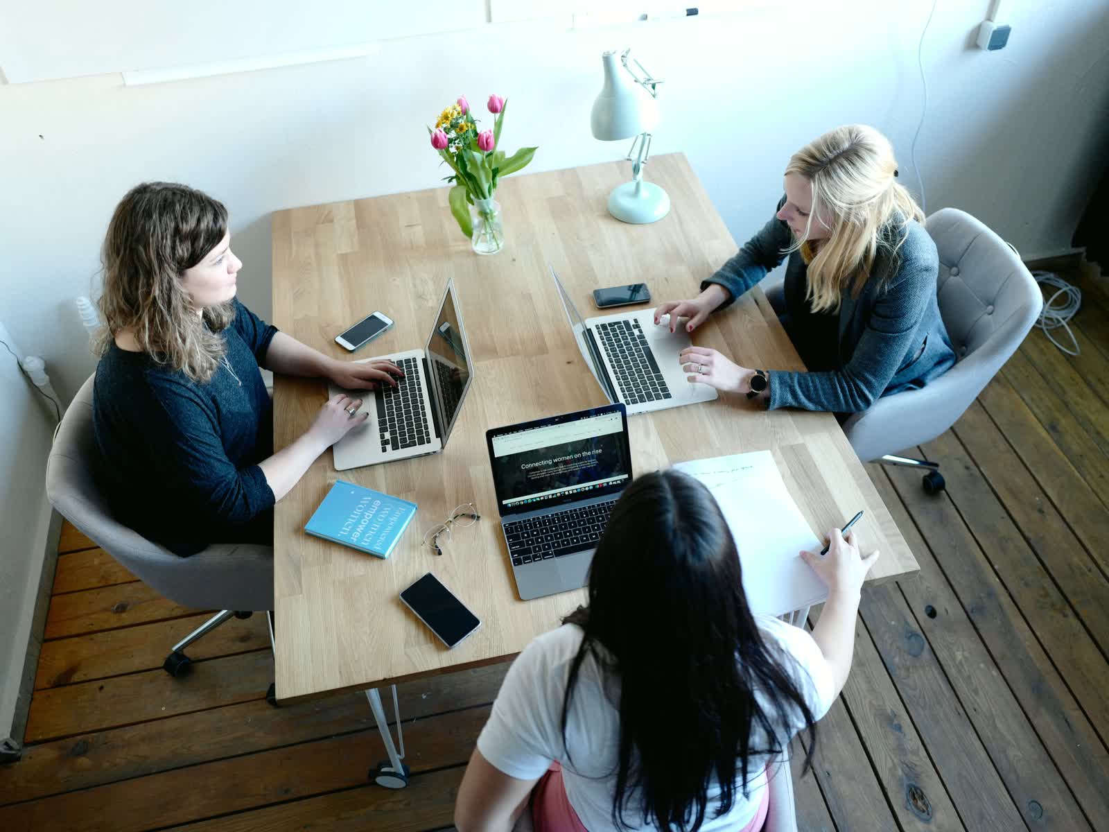 A small team building software together on laptops